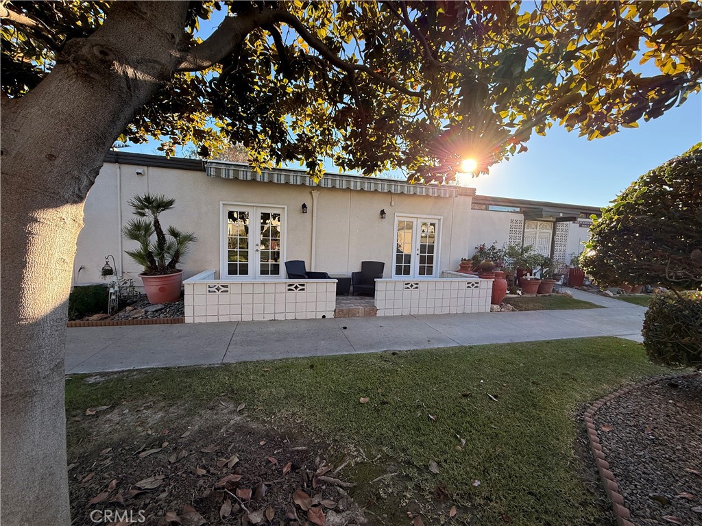 1921 St John Road, Unit 35C Seal Beach, CA 90740 - Photo 36 of 40 a front view of a house with patio