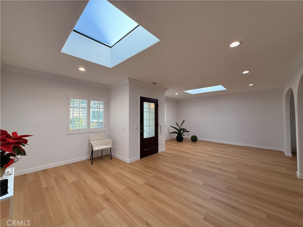 1921 St John Road, Unit 35C Seal Beach, CA 90740 - Photo 4 of 40 a view of a big room with wooden floor and furniture