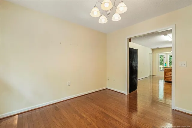 an empty room with wooden floor