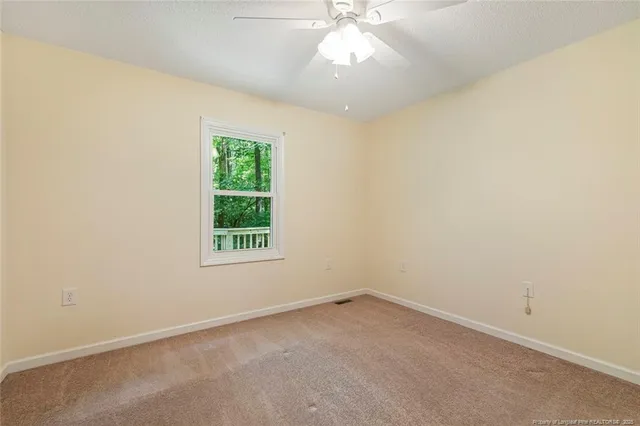 an empty room with a bathroom