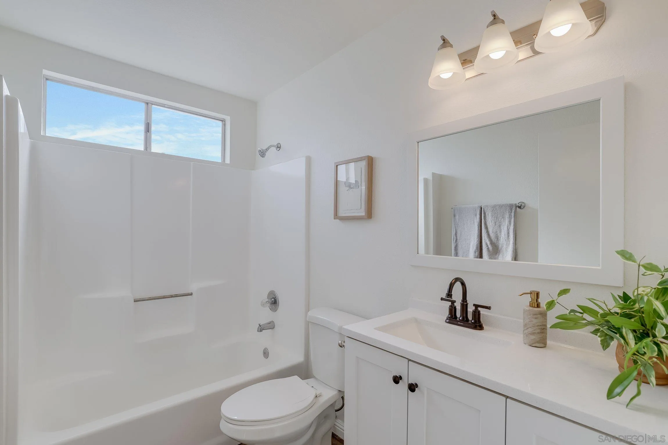 2305 Peppermint Lane Lemon Grove, CA 91945 - Photo 17 of 25 a bathroom with a granite countertop sink a toilet and mirror