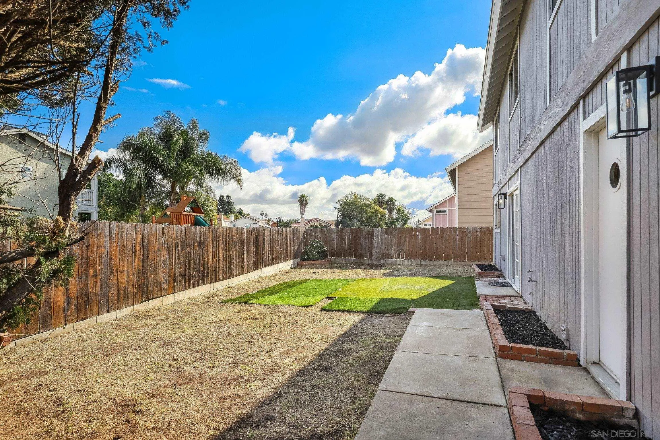 2305 Peppermint Lane Lemon Grove, CA 91945 - Photo 21 of 25 a view of a backyard with swimming pool