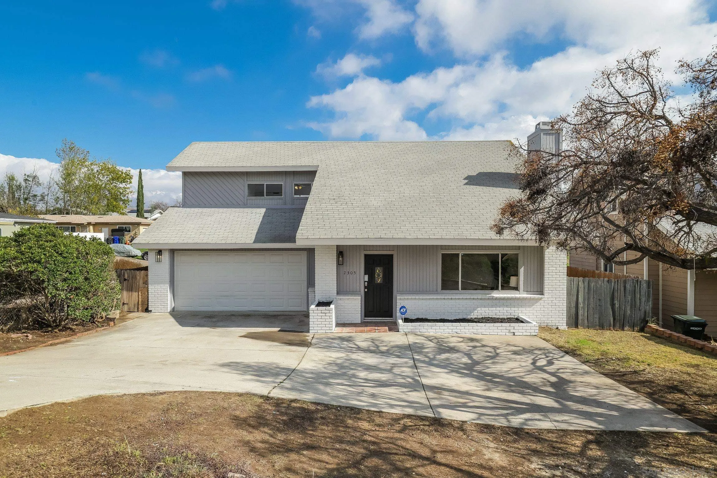 2305 Peppermint Lane Lemon Grove, CA 91945 - Photo 23 of 25 a front view of a house with a yard