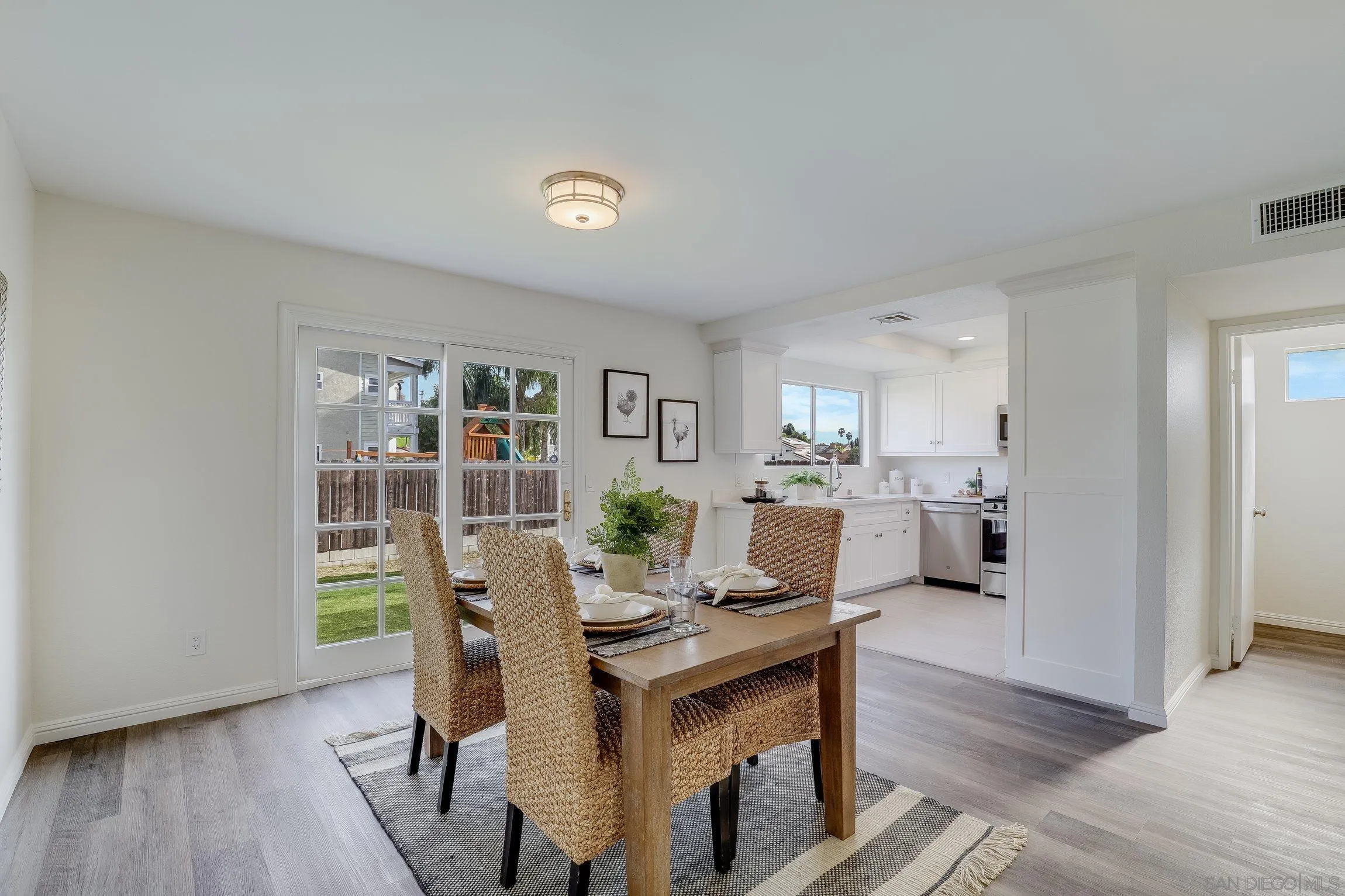 2305 Peppermint Lane Lemon Grove, CA 91945 - Photo 6 of 25 a view of a dining room with furniture and wooden floor
