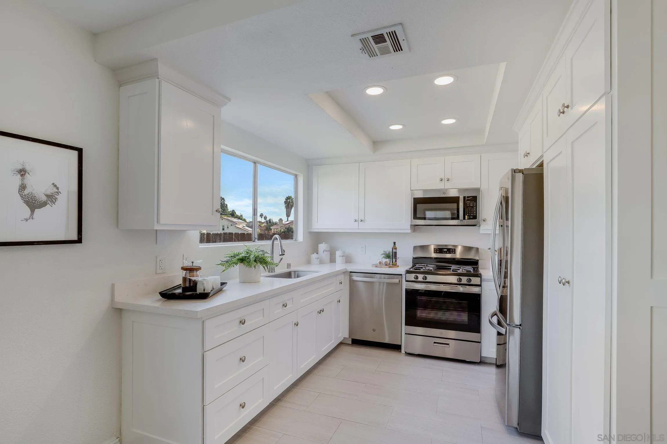 2305 Peppermint Lane Lemon Grove, CA 91945 - Photo 9 of 25 a kitchen with stainless steel appliances a stove sink and cabinets