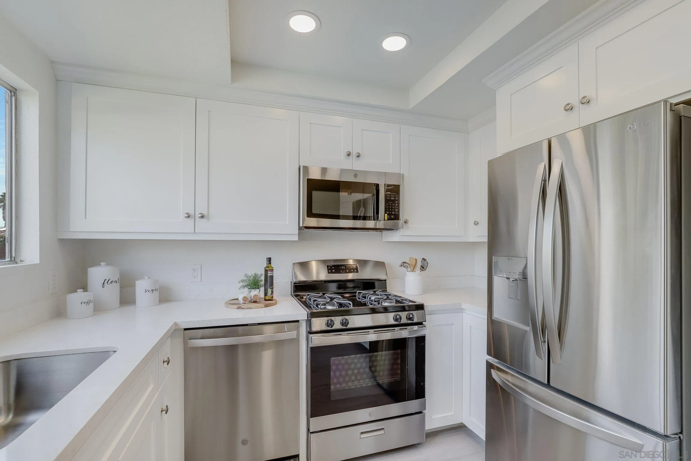 2305 Peppermint Lane Lemon Grove, CA 91945 - Photo 10 of 25 a kitchen with stainless steel appliances granite countertop a refrigerator stove and sink