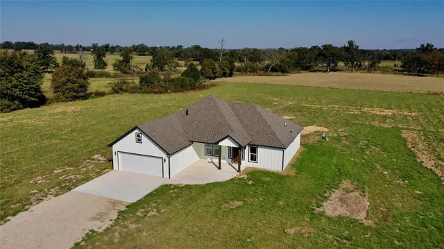a view of a lake with a yard