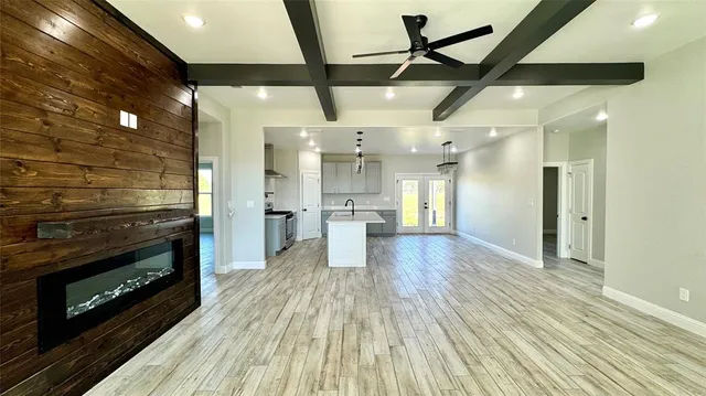 a view of a kitchen with a stove cabinets and wooden floor