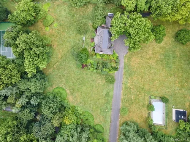 an aerial view of residential house with an outdoor space