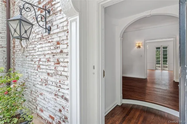 a view of entryway with wooden floor
