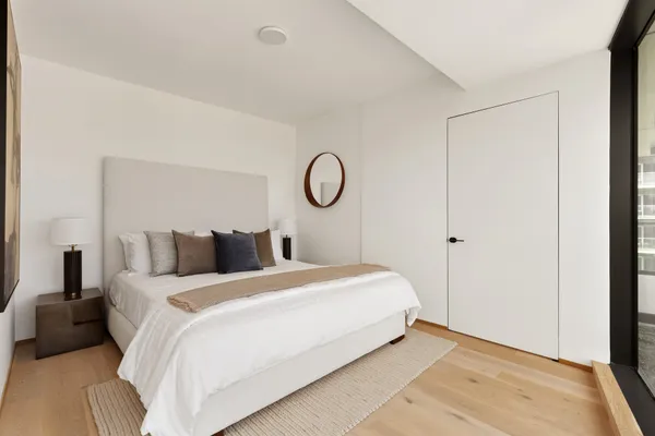 a bedroom with a bed and window