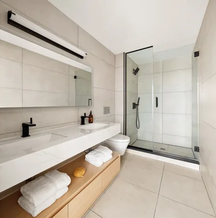 a spacious bathroom with a tub shower and sink