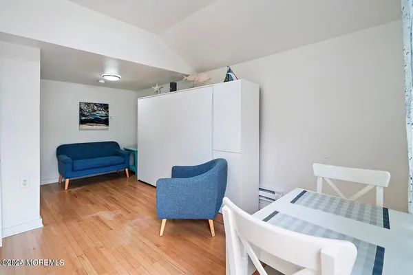 a blue and white sitting area with furniture
