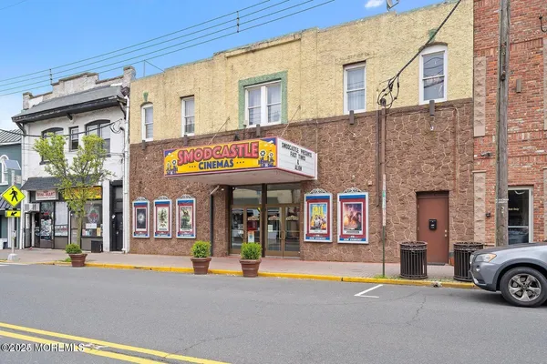 a front view of a building with parking