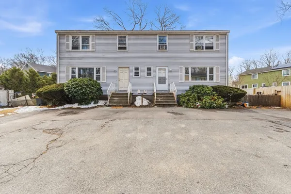 front view of a house with a yard