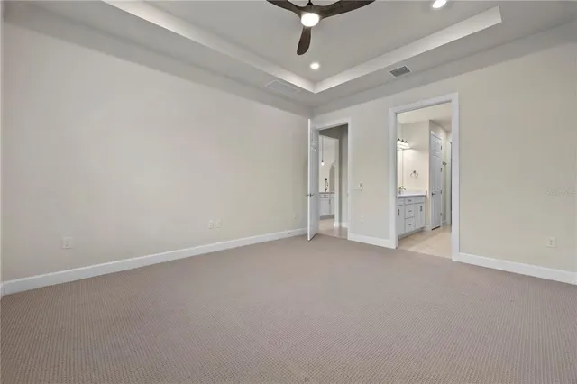 a bathroom with a sink vanity and mirror