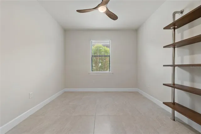an aerial view of multiple houses with a yard