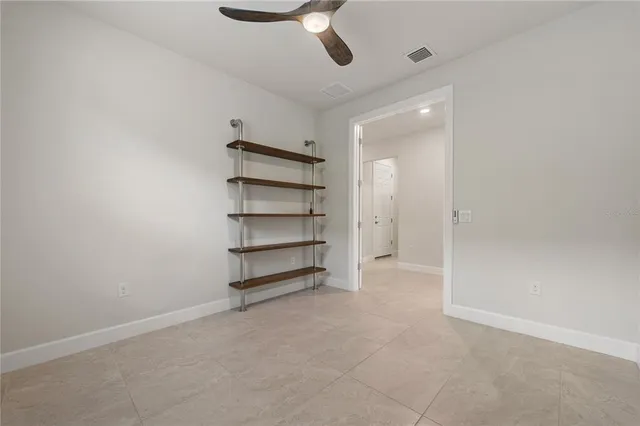 an aerial view of residential houses with outdoor space and swimming pool