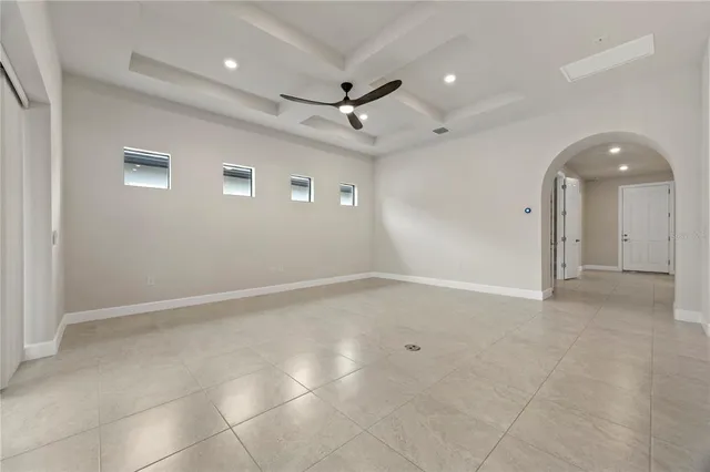 a view of a kitchen with a stove cabinets and a ceiling fan