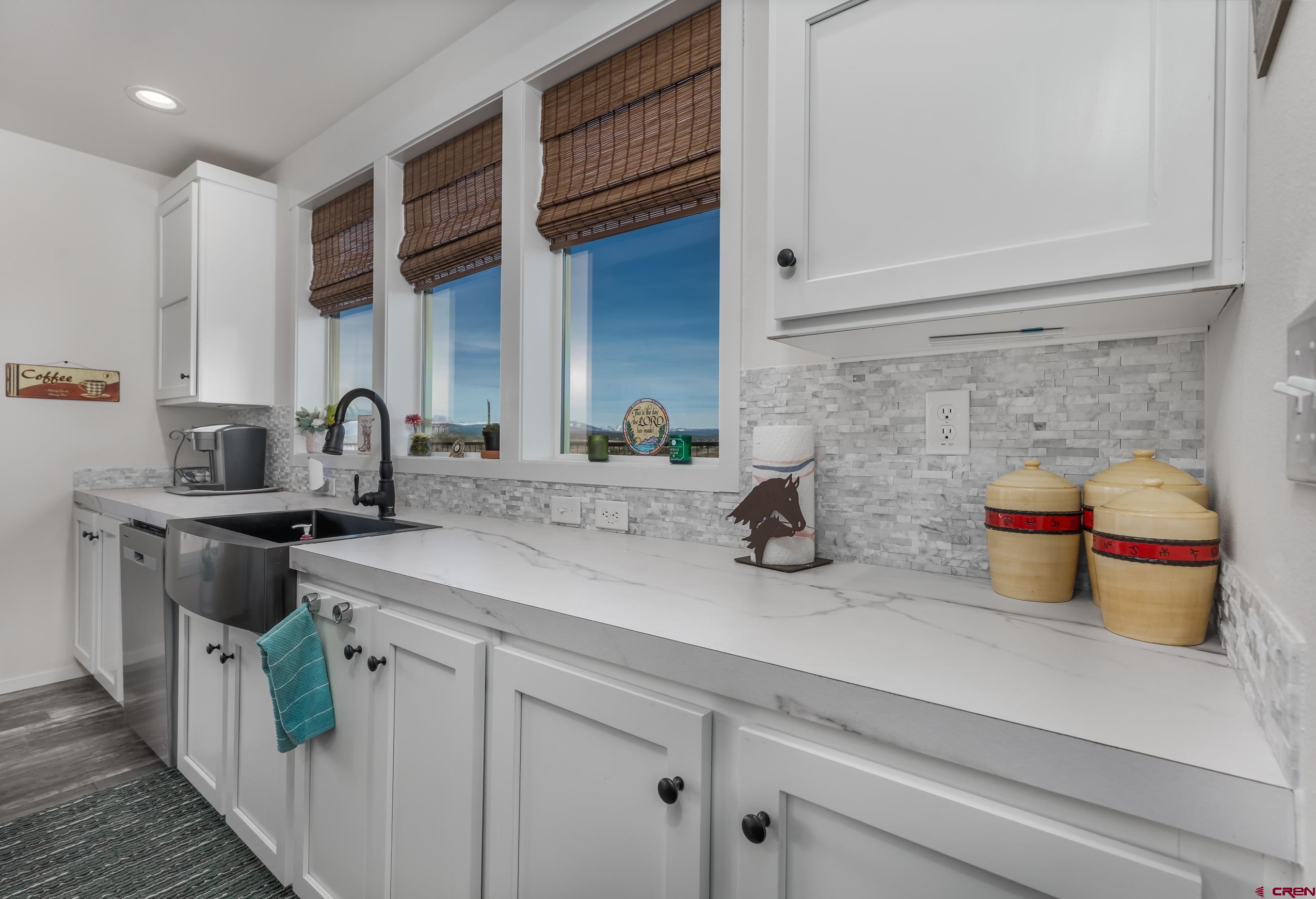 5102 County Road 311 Ignacio, CO 81137 - Photo 9 of 36 a kitchen with a sink and a stove top oven