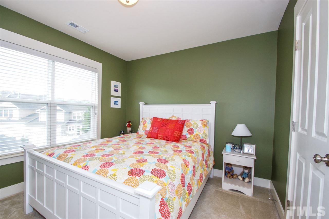 2244 Dunlin Lane Raleigh, NC 27614 - Photo 14 of 23 a bedroom with a bed and window