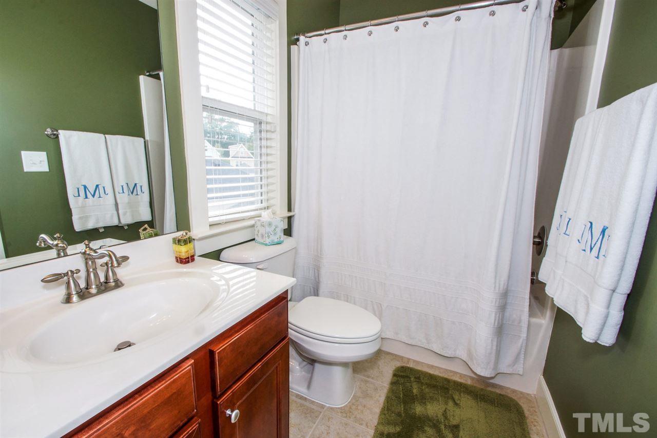 2244 Dunlin Lane Raleigh, NC 27614 - Photo 15 of 23 a bathroom with a sink a toilet and a mirror