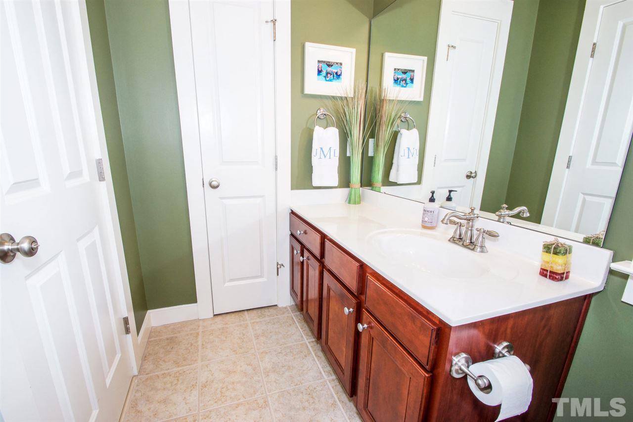 2244 Dunlin Lane Raleigh, NC 27614 - Photo 16 of 23 a bathroom with a sink and a mirror
