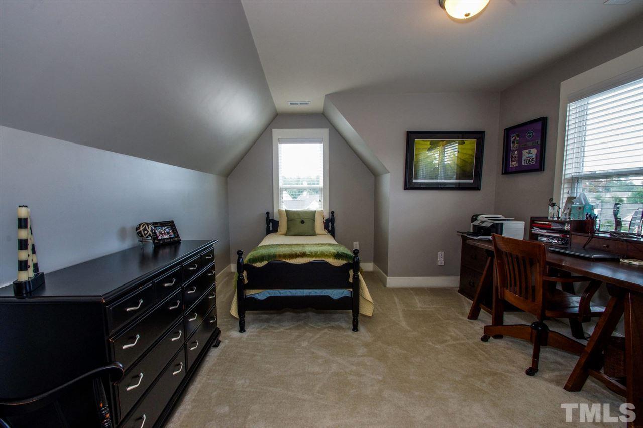 2244 Dunlin Lane Raleigh, NC 27614 - Photo 18 of 23 a bedroom with a bed and a desk