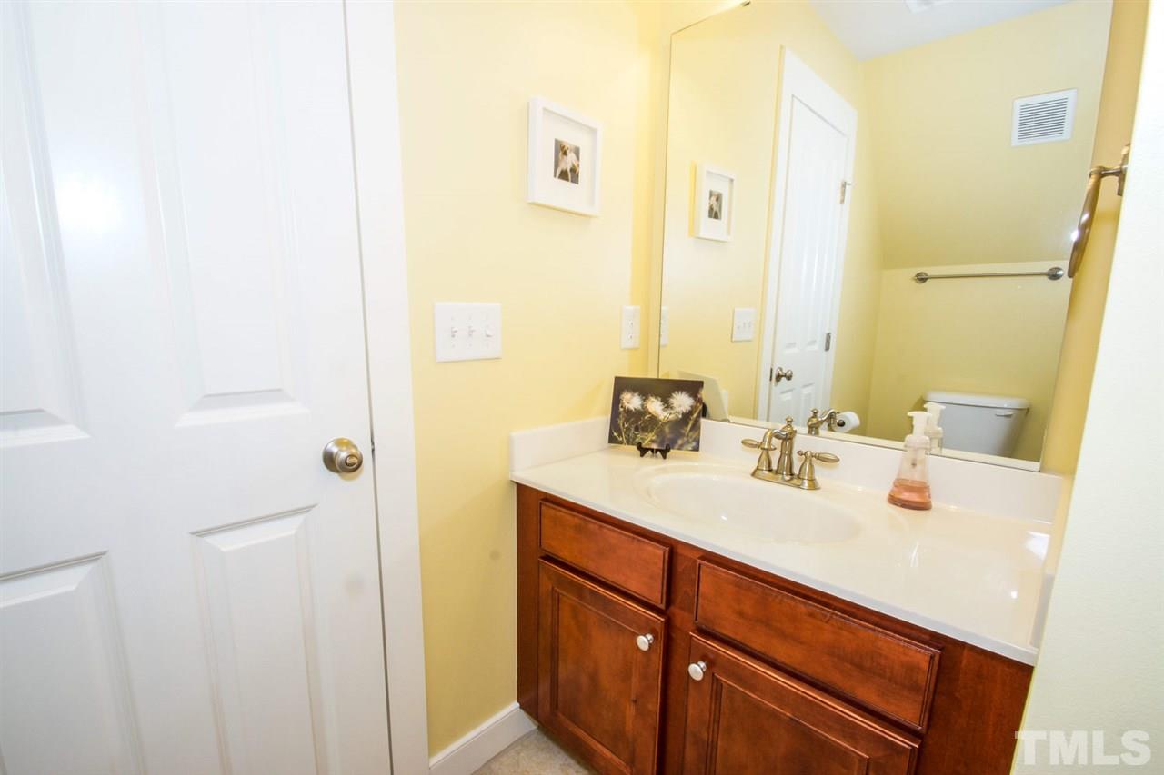 2244 Dunlin Lane Raleigh, NC 27614 - Photo 19 of 23 a bathroom with a sink and a mirror