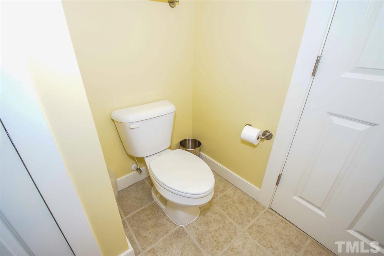 2244 Dunlin Lane Raleigh, NC 27614 - Photo 20 of 23 a white toilet sitting next to a sink