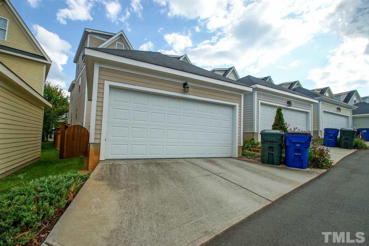 2244 Dunlin Lane Raleigh, NC 27614 - Photo 23 of 23 two view of a house with a yard and garage