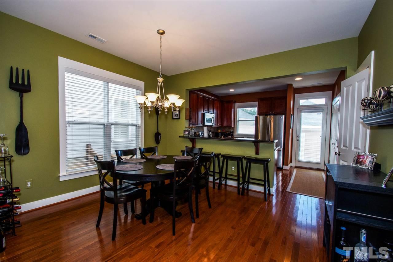 2244 Dunlin Lane Raleigh, NC 27614 - Photo 7 of 23 a view of a dining room with furniture window and wooden floor