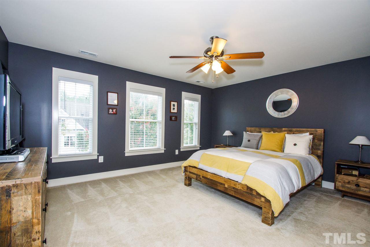 2244 Dunlin Lane Raleigh, NC 27614 - Photo 10 of 23 a bedroom with a bed and a flat screen tv