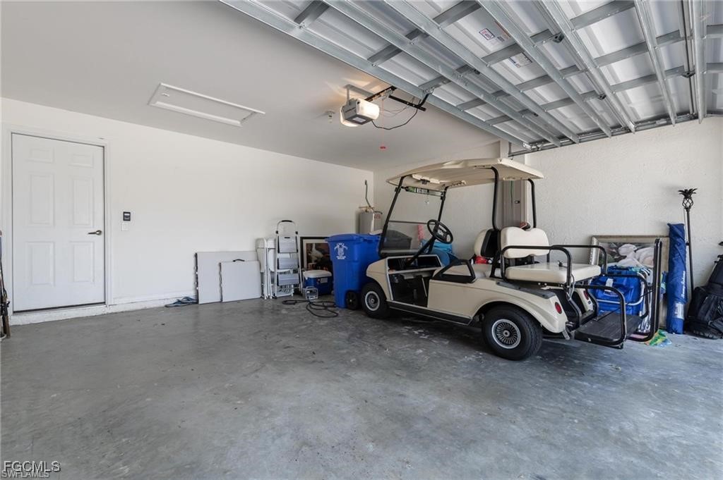 10074 Oakhurst Way Fort Myers, FL 33913 - Photo 15 of 32 a car parked in a garage