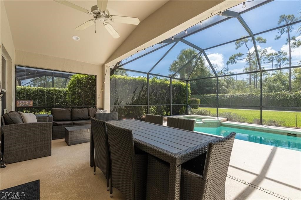 10074 Oakhurst Way Fort Myers, FL 33913 - Photo 16 of 32 a patio with a table and chairs