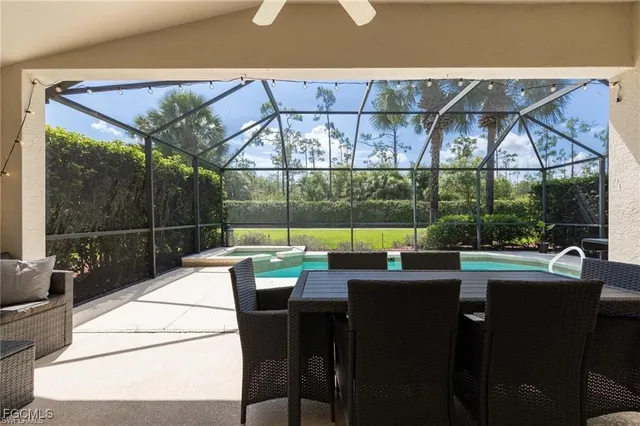 a view of a patio with a table chairs and a tub