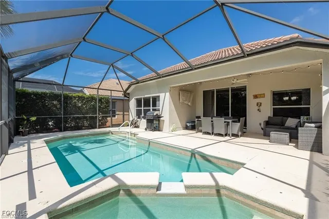 a view of a backyard with swimming pool