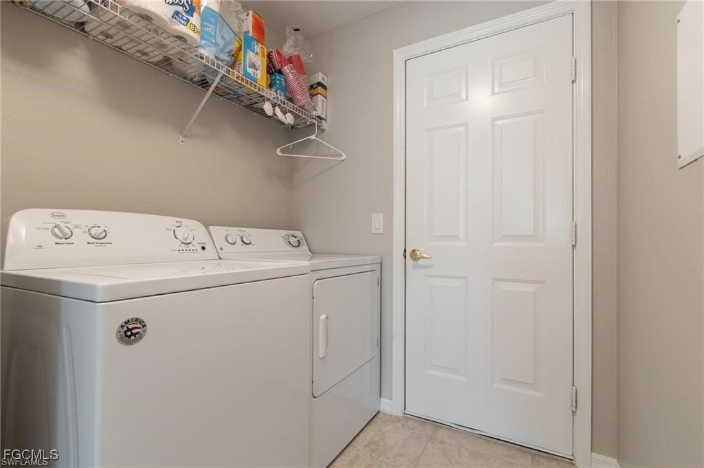 10074 Oakhurst Way Fort Myers, FL 33913 - Photo 22 of 32 a utility room with dryer and washer
