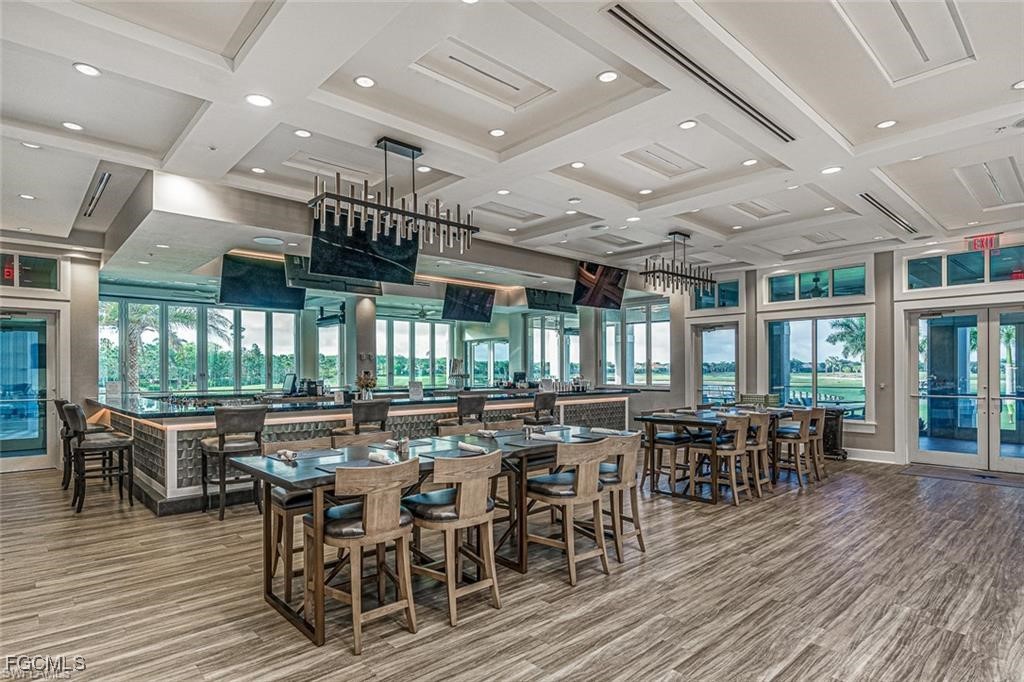10074 Oakhurst Way Fort Myers, FL 33913 - Photo 28 of 32 a view of a dining room with furniture window and wooden floor