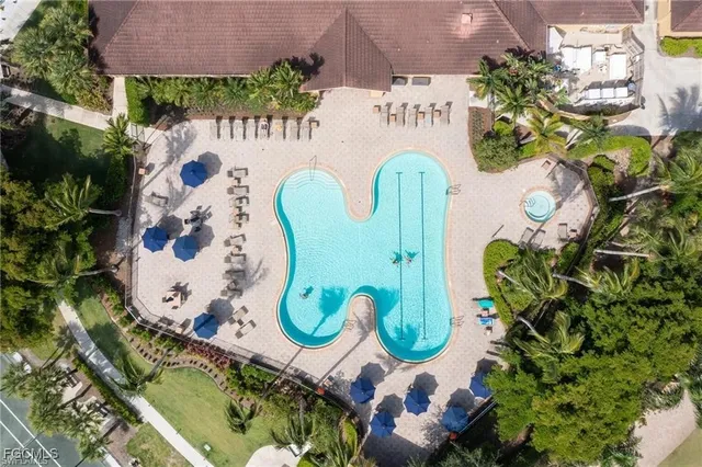 an aerial view of a swimming pool a garden