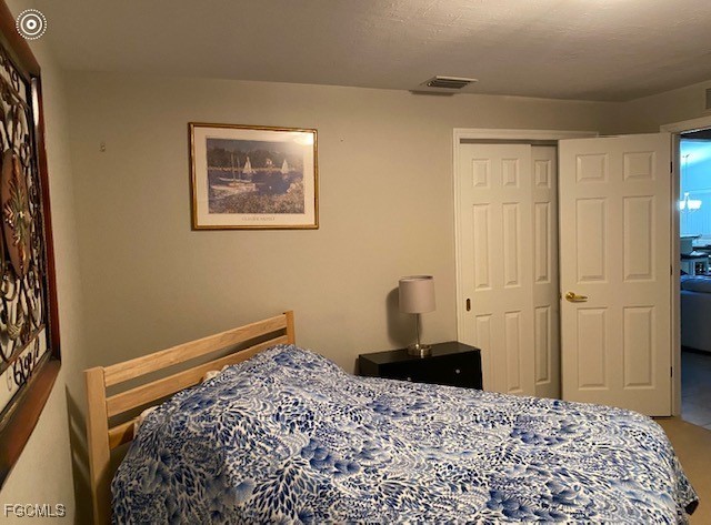 10074 Oakhurst Way Fort Myers, FL 33913 - Photo 10 of 32 a bedroom with a bed and a window