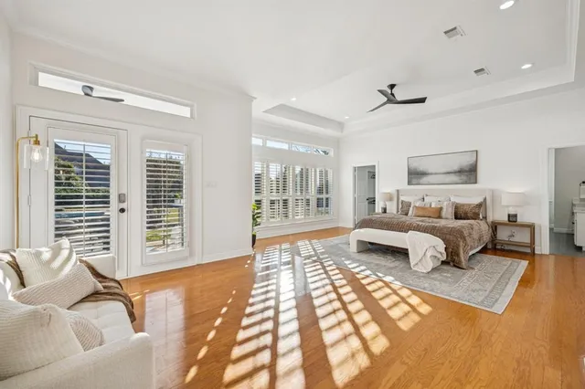 a bedroom with furniture and a large window