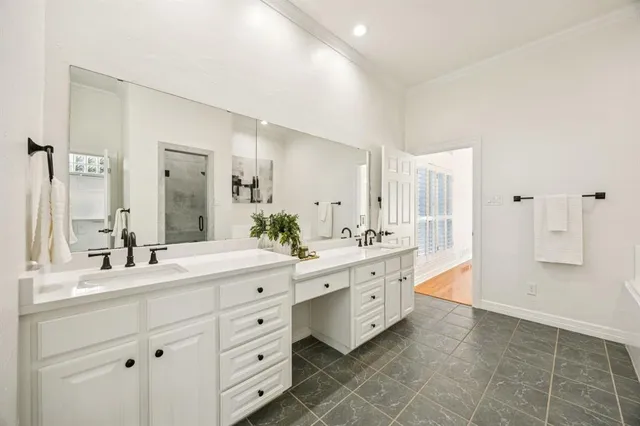 a spacious bathroom with a double vanity sink mirror and double