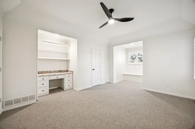 an empty room with a empty space and windows