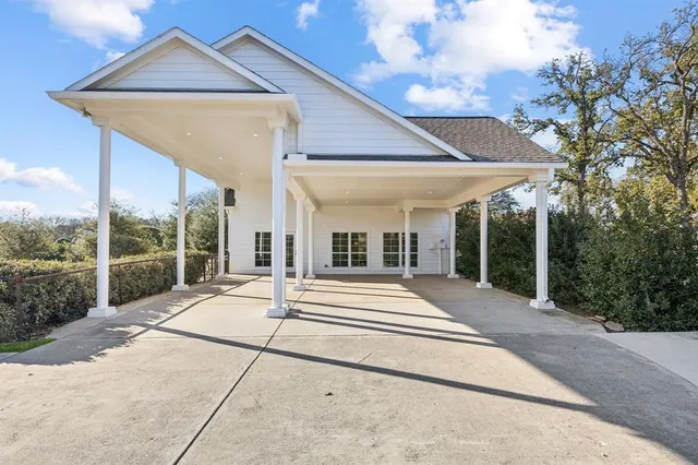 a view of a house with a backyard and balcony