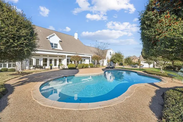 a view of a swimming pool with an outdoor seating