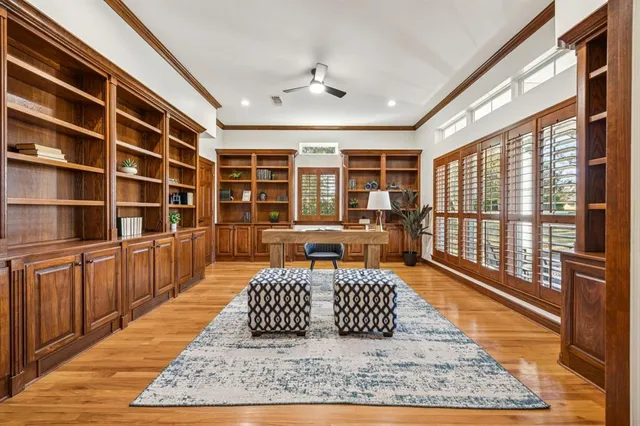 a living room with a couch wooden floor and a table