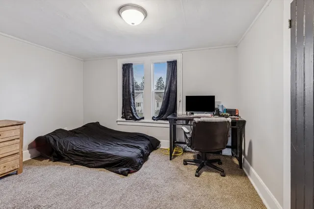 a workspace with furniture and a window