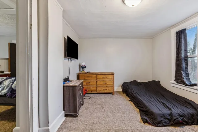 a room with furniture and flat screen tv