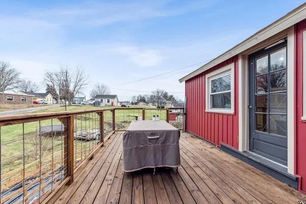 a balcony with wooden floor